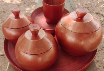 Three covered earthenware pots pictured in the nature-based products section.